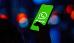 In this photo illustration, the WhatsApp logo is displayed on a smartphone screen