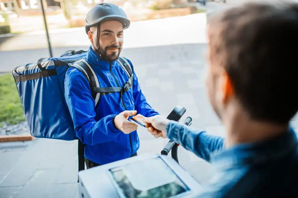 man delivering food on a scooter