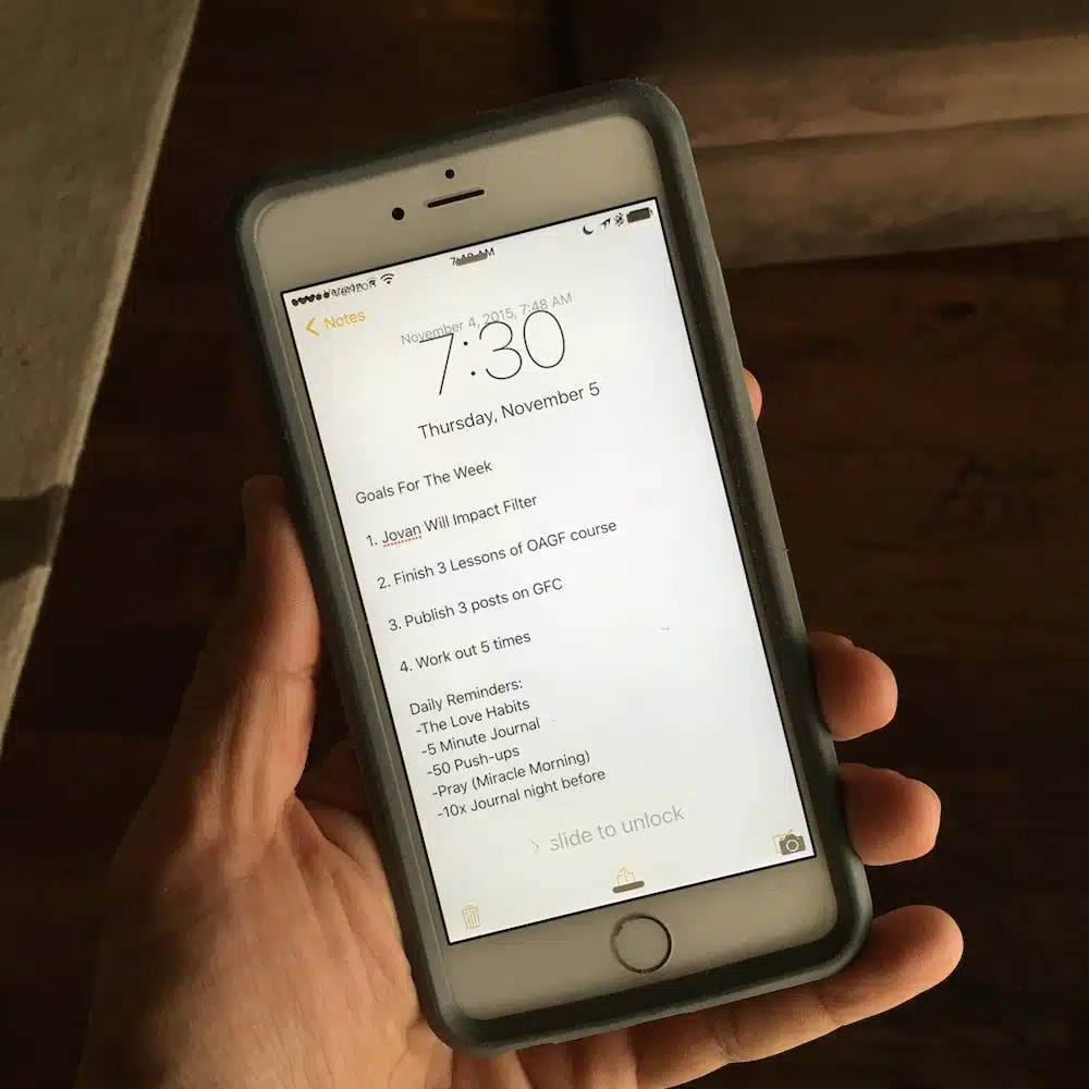 picture of an iphone showing short term goals on the lock screen